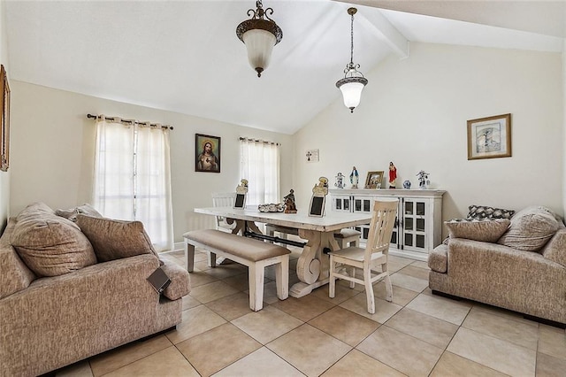 1929 Jean Lafitte Blvd, Lafitte, LA 70067 - dining area featuring light tile patterned floors, beamed ceiling, and high vaulted ceiling