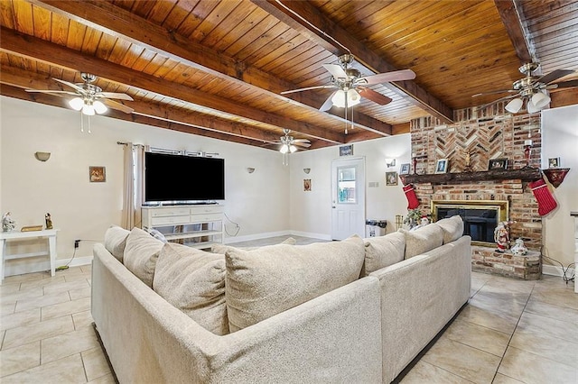 1929 Jean Lafitte Blvd, Lafitte, LA 70067 - living area featuring ceiling fan, a wooden ceiling with exposed beams, a fireplace, and light tile patterned floors