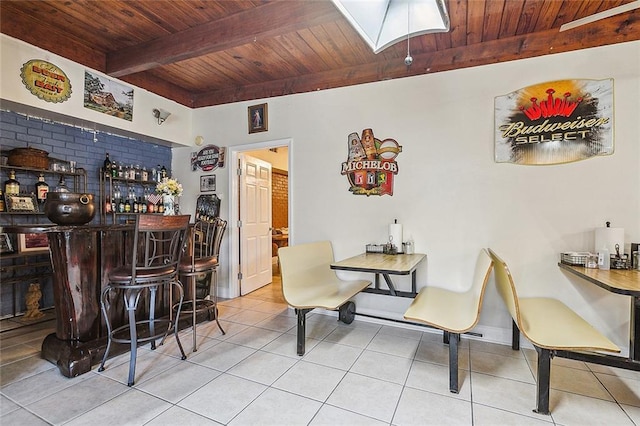 1929 Jean Lafitte Blvd, Lafitte, LA 70067 - tiled dining room featuring a wood ceiling with exposed beams and a bar