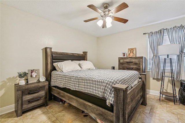 1929 Jean Lafitte Blvd, Lafitte, LA 70067 - bedroom featuring light tile patterned floors and a ceiling fan