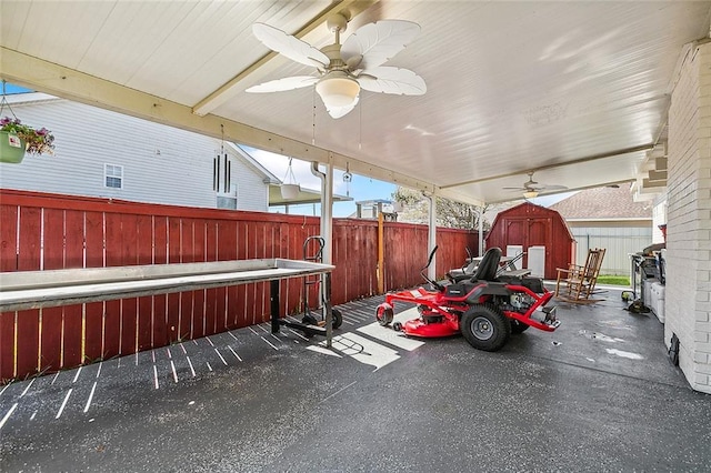 1929 Jean Lafitte Blvd, Lafitte, LA 70067 - fenced backyard featuring a shed and a ceiling fan
