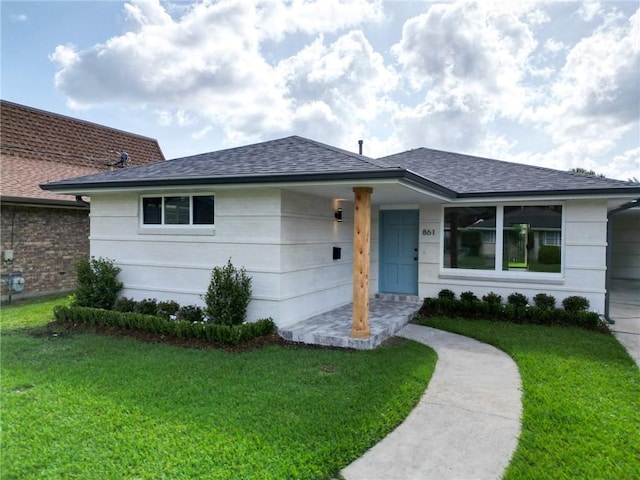 861 W William David Pkwy, Metairie, LA 70005 - ranch-style house with a front yard and roof with shingles