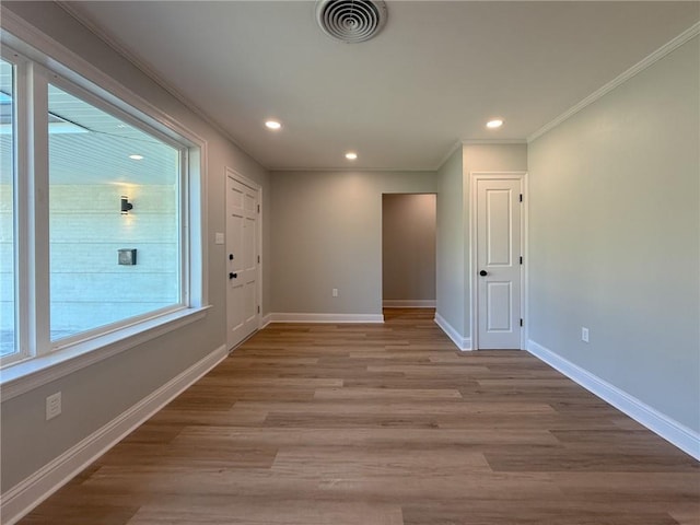 861 W William David Pkwy, Metairie, LA 70005 - empty room featuring ornamental molding, recessed lighting, and light wood finished floors