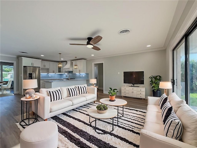 861 W William David Pkwy, Metairie, LA 70005 - living area featuring dark wood-style floors, crown molding, recessed lighting, and ceiling fan