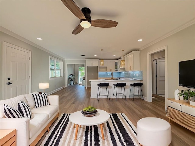 861 W William David Pkwy, Metairie, LA 70005 - living room featuring ornamental molding, a ceiling fan, light wood finished floors, and recessed lighting