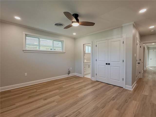 861 W William David Pkwy, Metairie, LA 70005 - unfurnished bedroom with crown molding, light wood finished floors, ensuite bathroom, a closet, and recessed lighting
