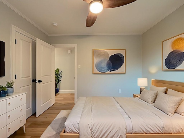 861 W William David Pkwy, Metairie, LA 70005 - bedroom with ornamental molding, light wood finished floors, and ceiling fan