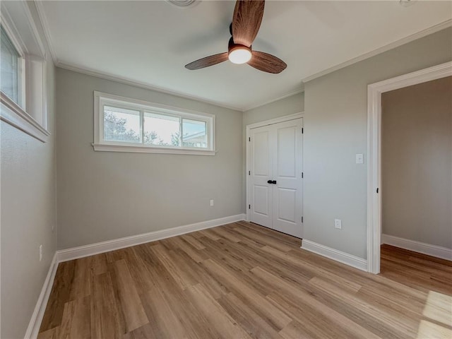 861 W William David Pkwy, Metairie, LA 70005 - unfurnished bedroom featuring light wood-style flooring, crown molding, a closet, and ceiling fan