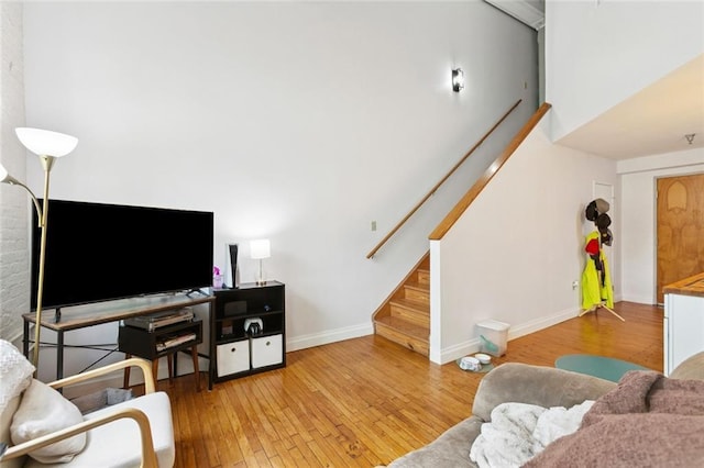 920 Poeyfarre St Unit 326, New Orleans, LA 70130 - living room featuring stairway and hardwood / wood-style flooring