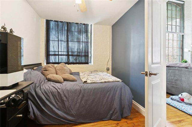 920 Poeyfarre St Unit 326, New Orleans, LA 70130 - bedroom featuring wood finished floors and a ceiling fan