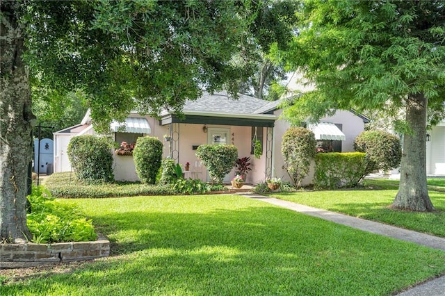 4430 Karen Ave, Jefferson, LA 70121 - ranch-style house with a front yard, stucco siding, and a shingled roof