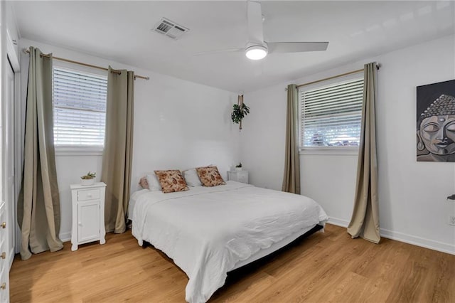 4430 Karen Ave, Jefferson, LA 70121 - bedroom featuring multiple windows, light wood finished floors, and a ceiling fan