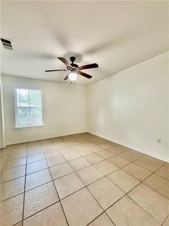 70330 C St, Covington, LA 70433 - unfurnished room featuring light tile patterned floors and ceiling fan