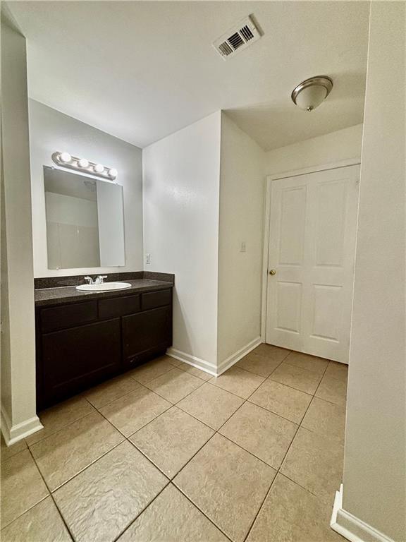70330 C St, Covington, LA 70433 - bathroom with vanity and tile patterned floors