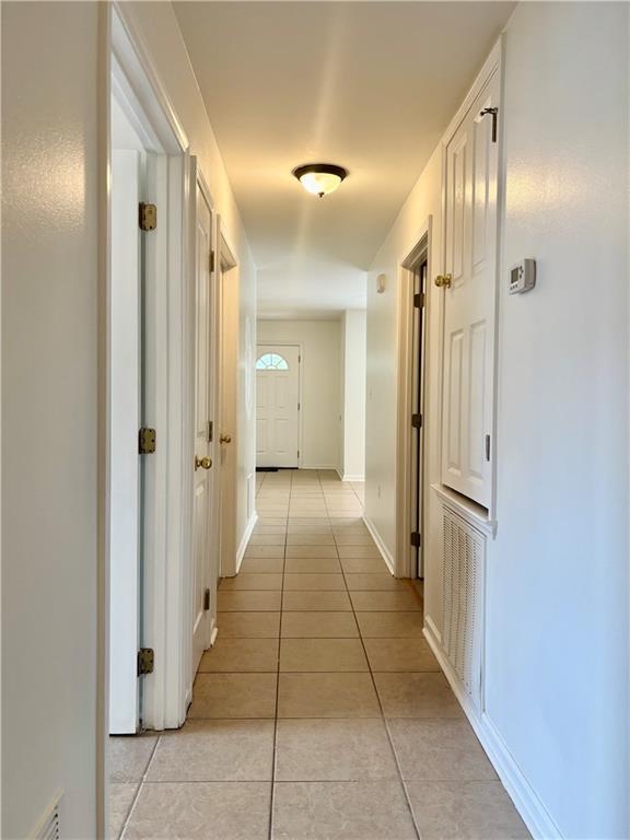 70330 C St, Covington, LA 70433 - hall featuring light tile patterned floors
