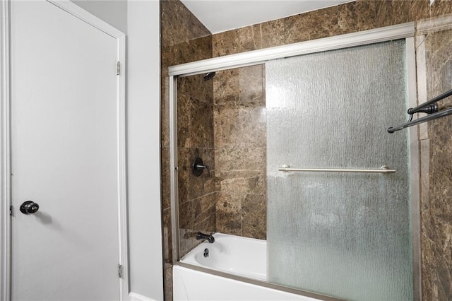 4218 Hessmer Ave Unit 217, Metairie, LA 70002 - bathroom featuring shower / bath combination with glass door