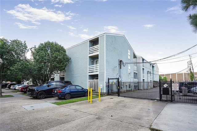 4218 Hessmer Ave Unit 217, Metairie, LA 70002 - view of building exterior with uncovered parking