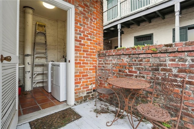 1133 Royal St Unit 7, New Orleans, LA 70116 - doorway to property featuring brick siding and a balcony