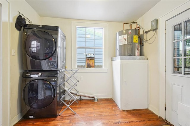 1821 Urquhart St, New Orleans, LA 70116 - laundry room with stacked washer / dryer, water heater, and wood finished floors