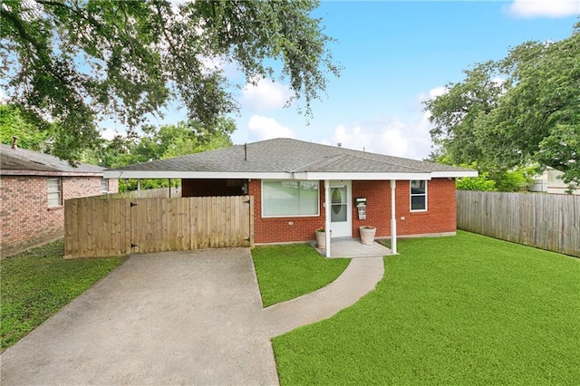 212 7th St, Bridge City, LA 70094 - view of front of property with a gate, brick siding, roof with shingles, and concrete driveway