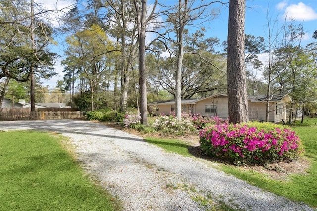 124 N Dr, Covington, LA 70433 - view of front of property featuring gravel driveway