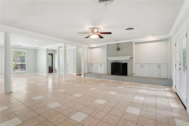 124 N Dr, Covington, LA 70433 - unfurnished living room with decorative columns, crown molding, light tile patterned floors, ceiling fan, and a brick fireplace