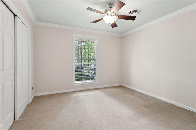 124 N Dr, Covington, LA 70433 - unfurnished bedroom featuring light carpet, ornamental molding, a closet, and a ceiling fan
