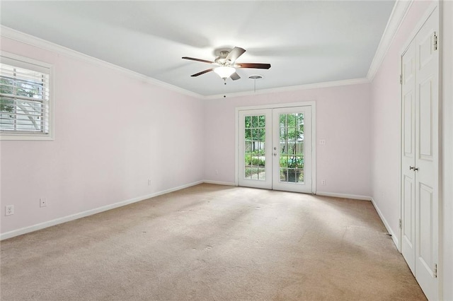 124 N Dr, Covington, LA 70433 - empty room featuring plenty of natural light, a ceiling fan, carpet, ornamental molding, and french doors