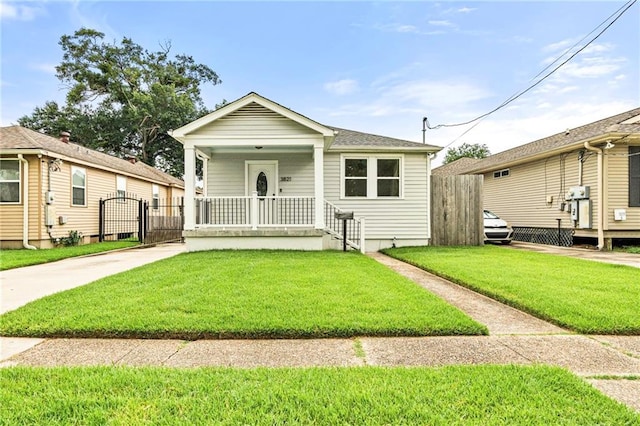 3821 Bauvais St, Metairie, LA 70001 - view of front of home with a gate and covered porch