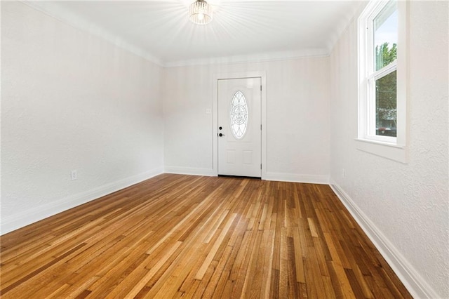 3821 Bauvais St, Metairie, LA 70001 - foyer entrance with healthy amount of natural light, hardwood / wood-style flooring, a chandelier, and a textured wall