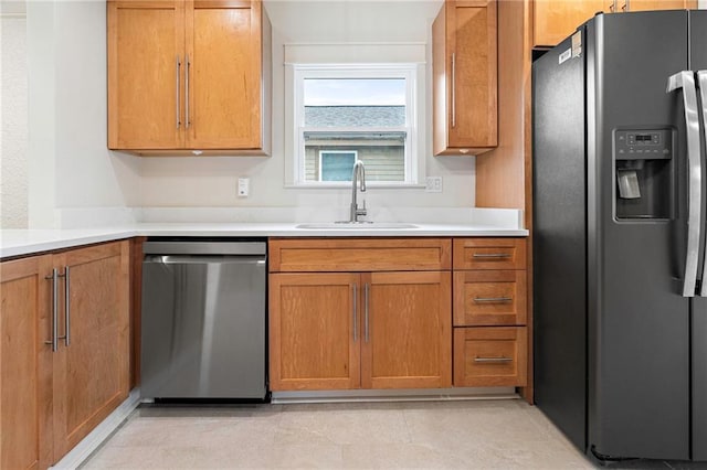 3821 Bauvais St, Metairie, LA 70001 - kitchen with appliances with stainless steel finishes, brown cabinetry, and light countertops