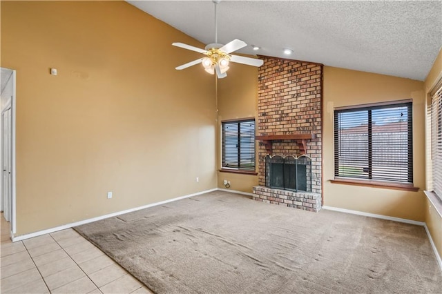1701 Cambridge Dr, La Place, LA 70068 - unfurnished living room featuring a ceiling fan, a textured ceiling, high vaulted ceiling, a fireplace, and carpet flooring