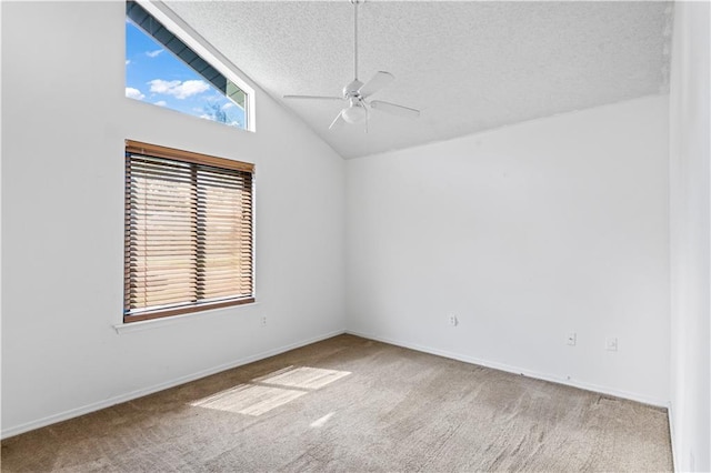 1701 Cambridge Dr, La Place, LA 70068 - empty room featuring a ceiling fan, carpet flooring, a textured ceiling, and lofted ceiling