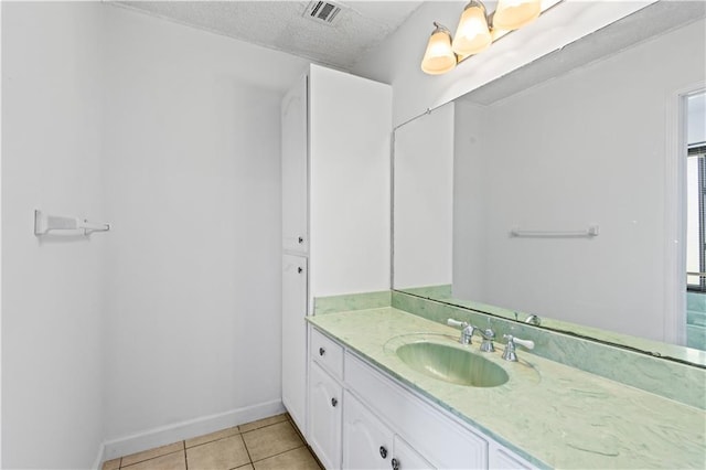 1701 Cambridge Dr, La Place, LA 70068 - bathroom with vanity, tile patterned flooring, and a textured ceiling