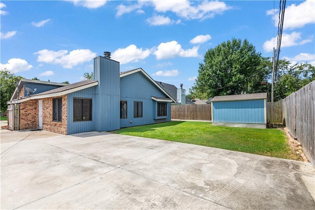 1701 Cambridge Dr, La Place, LA 70068 - back of house with a patio, a fenced backyard, a chimney, and a shed
