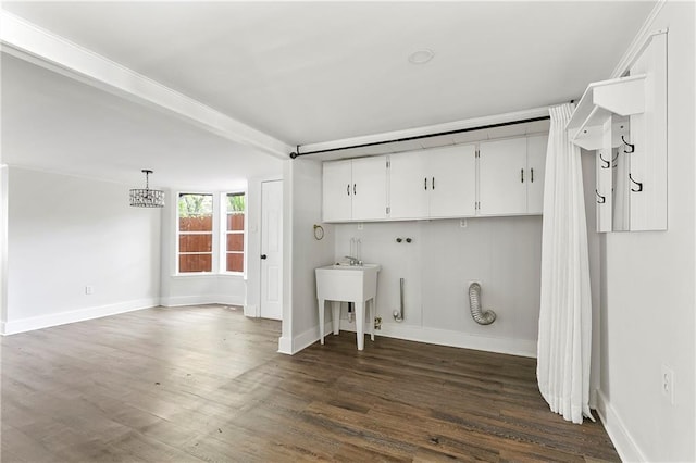 513 Roseland Pkwy, Harahan, LA 70123 - laundry area with cabinet space, dark wood-type flooring, and a chandelier