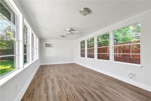 513 Roseland Pkwy, Harahan, LA 70123 - unfurnished sunroom featuring wood finished floors, healthy amount of natural light, and an AC wall unit