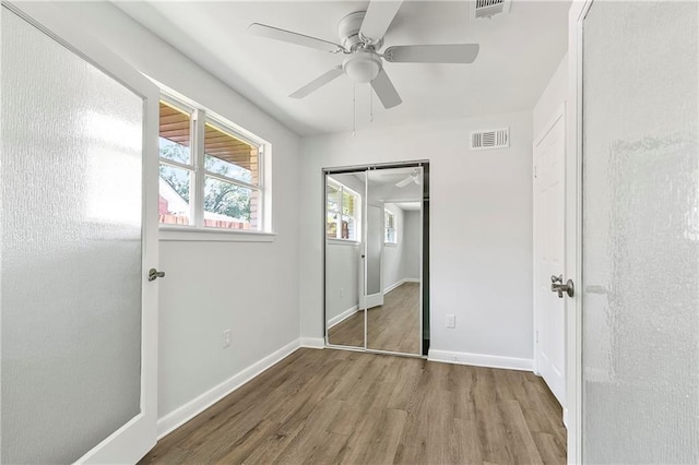 513 Roseland Pkwy, Harahan, LA 70123 - unfurnished bedroom with wood finished floors, ceiling fan, and a closet