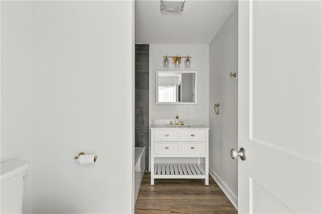 513 Roseland Pkwy, Harahan, LA 70123 - bathroom featuring vanity, wood finished floors, and shower / washtub combination