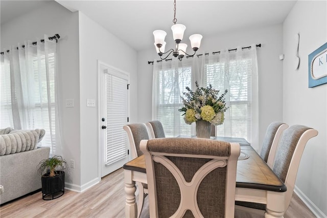 16168 S Trace Ext, Ponchatoula, LA 70454 - dining room featuring a chandelier and light wood finished floors