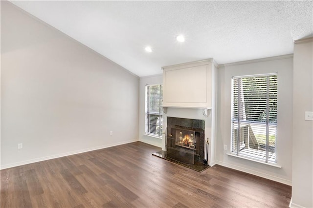 640 Tete Lours Dr Unit 1, Mandeville, LA 70471 - unfurnished living room with a fireplace, dark wood-type flooring, ornamental molding, recessed lighting, and a textured ceiling