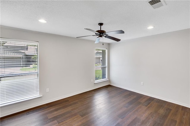 640 Tete Lours Dr Unit 1, Mandeville, LA 70471 - spare room with a textured ceiling, dark wood finished floors, a ceiling fan, and recessed lighting