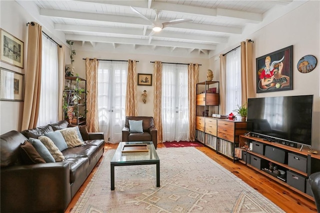827 Port St, New Orleans, LA 70117 - living area with wood finished floors, french doors, and a wooden ceiling with exposed beams