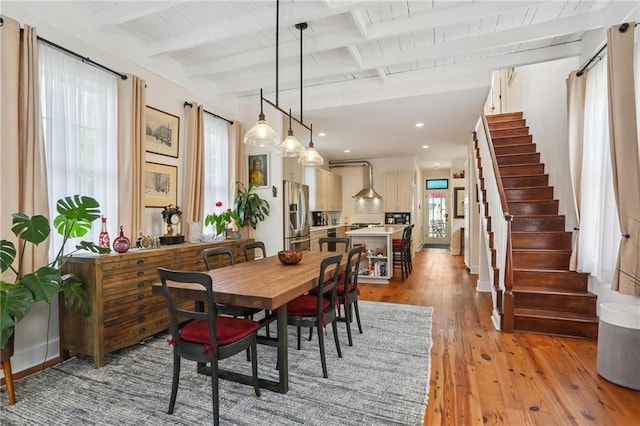 827 Port St, New Orleans, LA 70117 - dining room with light wood-style floors, healthy amount of natural light, stairs, recessed lighting, and a wooden ceiling with exposed beams