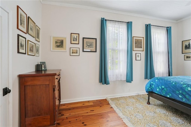 827 Port St, New Orleans, LA 70117 - bedroom with wood finished floors and crown molding