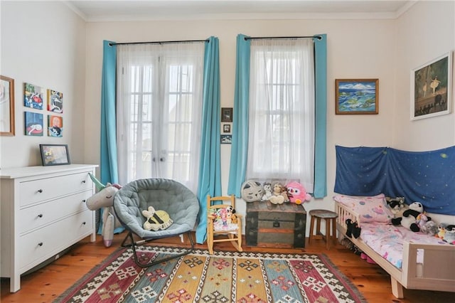 827 Port St, New Orleans, LA 70117 - living area featuring wood finished floors and ornamental molding