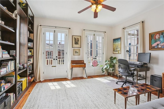 827 Port St, New Orleans, LA 70117 - office area featuring light wood-style floors, ceiling fan, and french doors