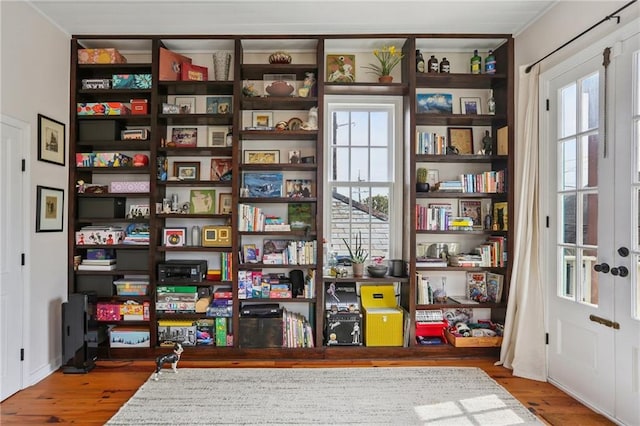 827 Port St, New Orleans, LA 70117 - interior space with healthy amount of natural light and wood finished floors