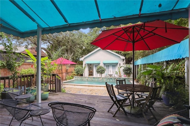 827 Port St, New Orleans, LA 70117 - deck with outdoor dining space, a storage structure, and an outbuilding