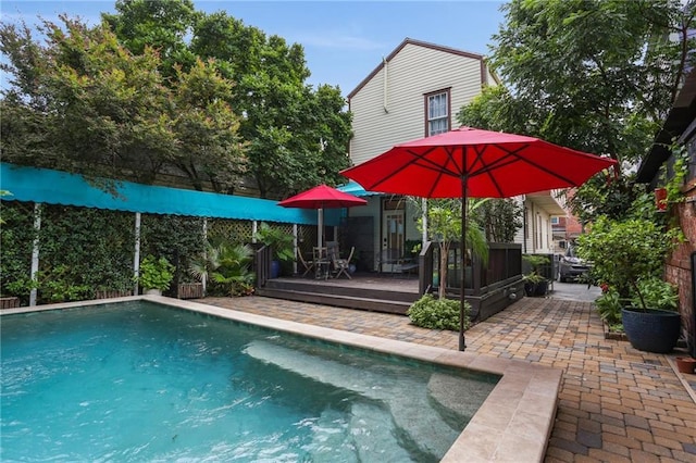 827 Port St, New Orleans, LA 70117 - view of swimming pool featuring a wooden deck and a patio area
